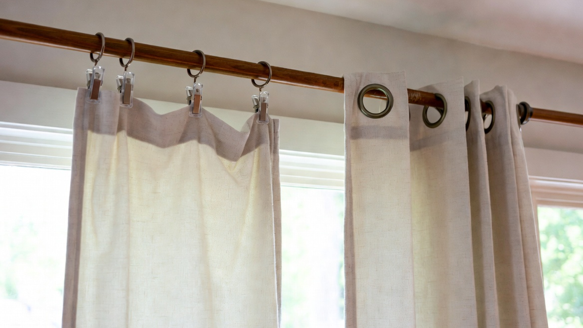 Comparison of clip rings and grommet curtains on two window setups in a bright room