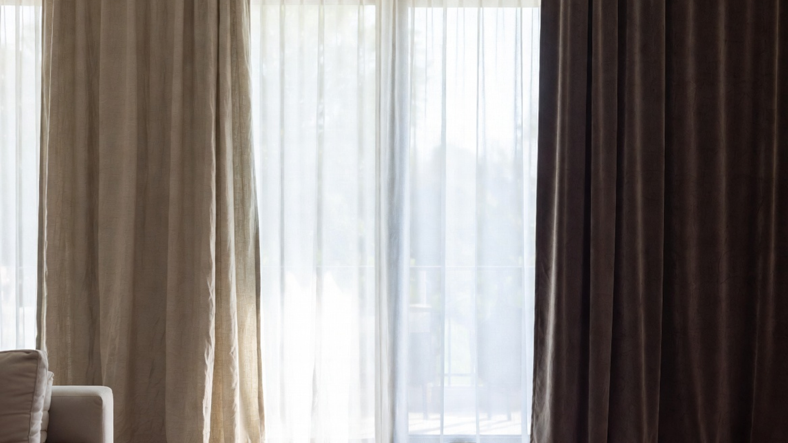 Linen, velvet, and sheer curtains styled in a bright home interior to compare texture, softness, and light control